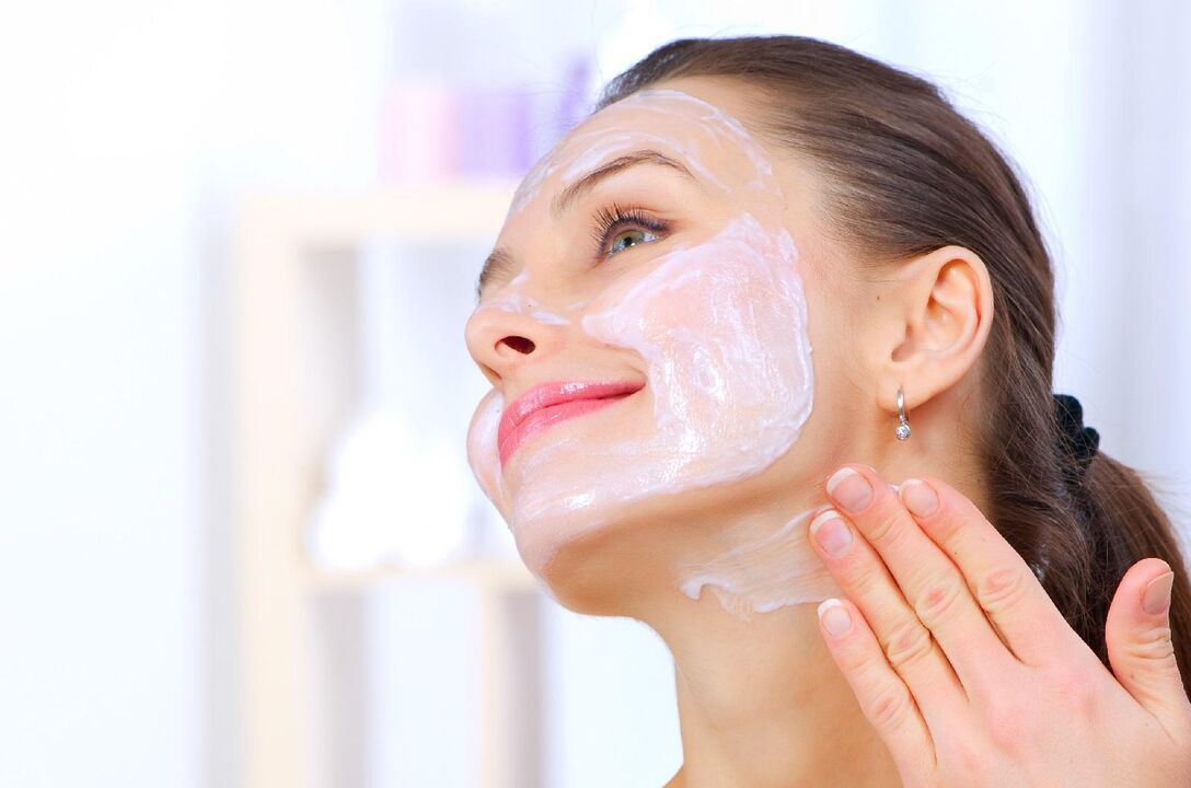 A woman rejuvenates her facial skin using a homemade mask